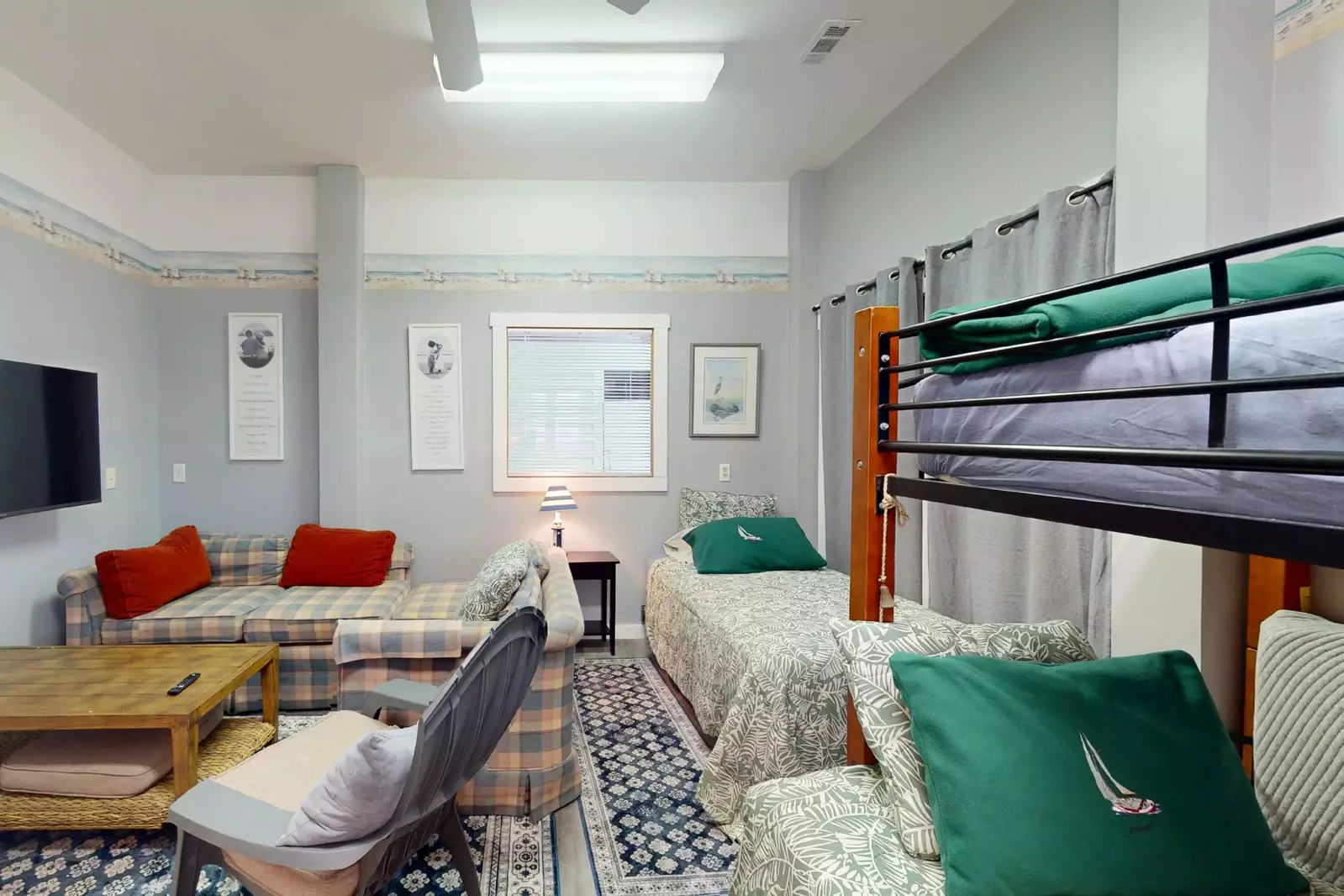 The bunk room also has a sitting area and wall mounted tv