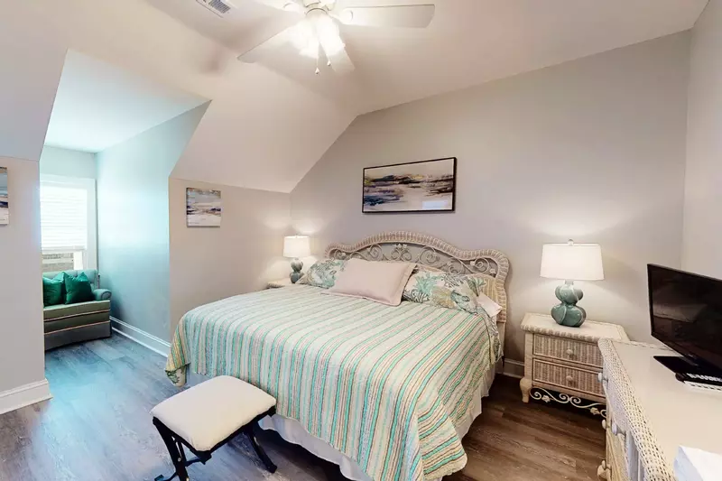 3rd bedroom top floor has a king bed and sitting area