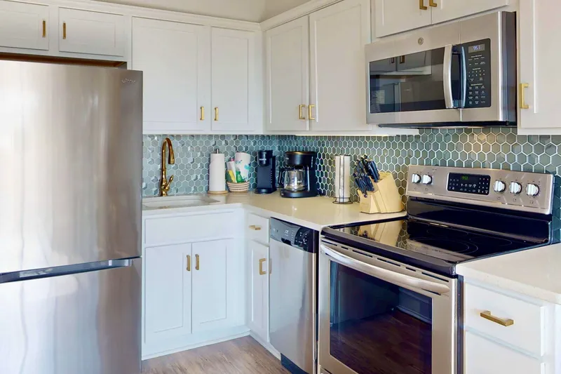 Updated kitchen with a coastal backsplash