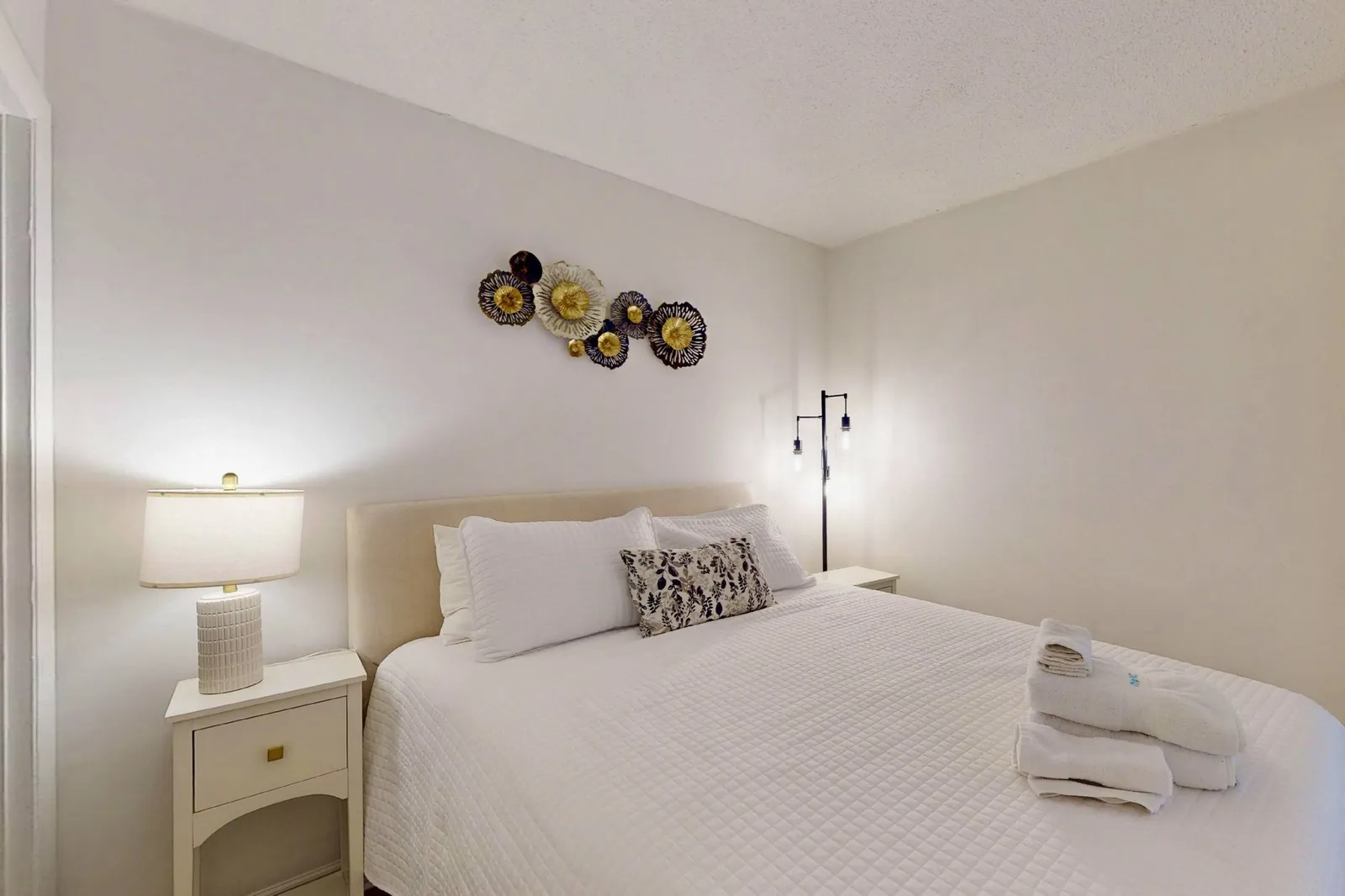 Second bedroom features a queen bed and private bathroom
