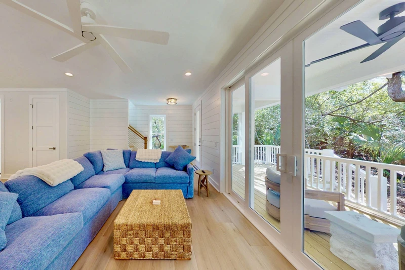 Double glass sliding doors offer copious amounts of natural light in the living area