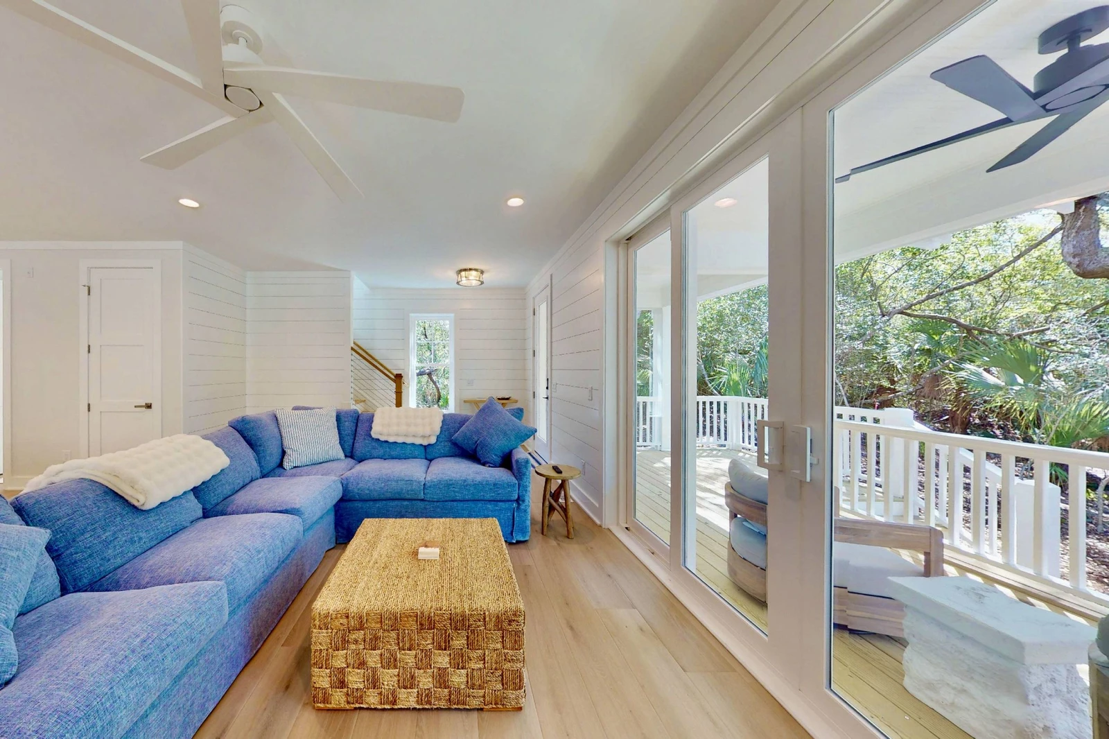 Double glass sliding doors offer copious amounts of natural light in the living area