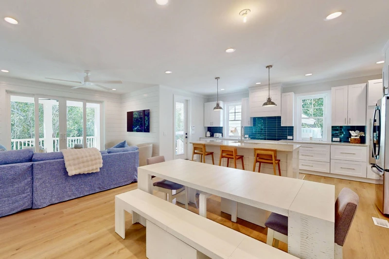 Gather around the large dining table for a family meal