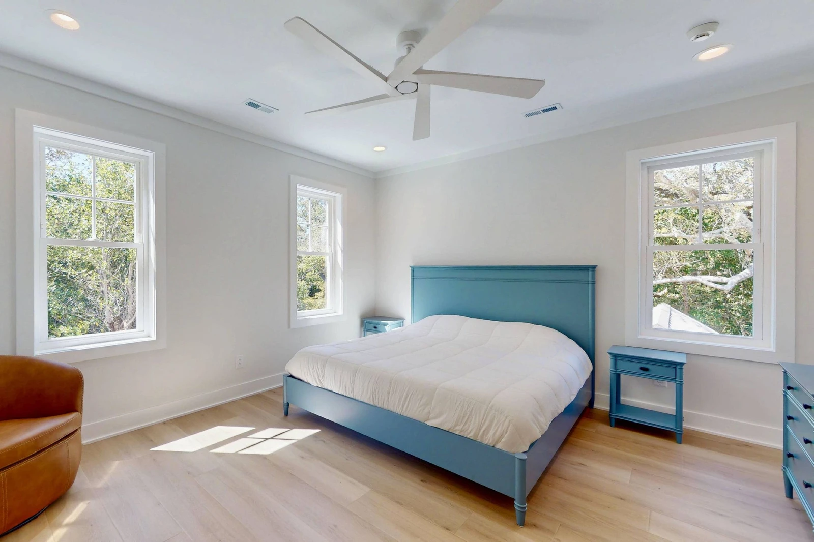 The upstairs suite offers a king bed, sitting area and plenty of natural light