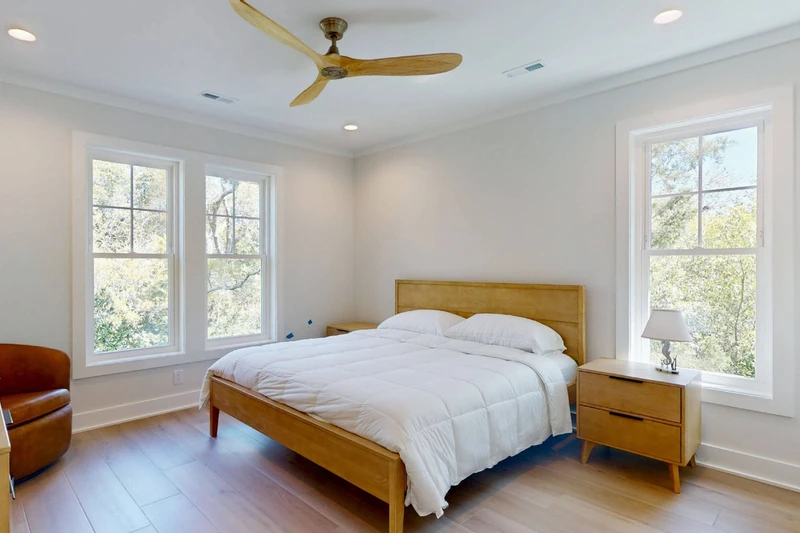 Bedroom 3 offers a king bed, sitting area and a lot of natural light