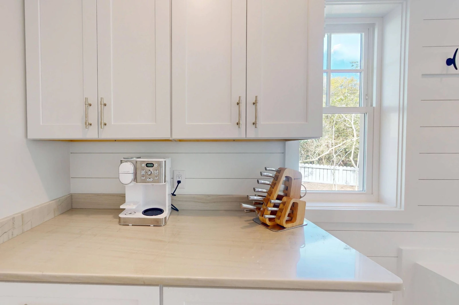 Even more counter space and cabinets are tucked next to the kitchen
