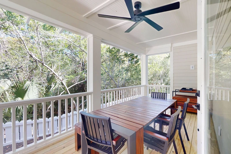 Enjoy a meal on the large back porch with an extendable dining table seating up to 12