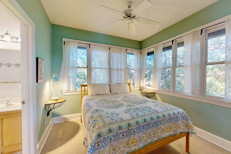 The second bedroom has a full bath, a plethora of windows