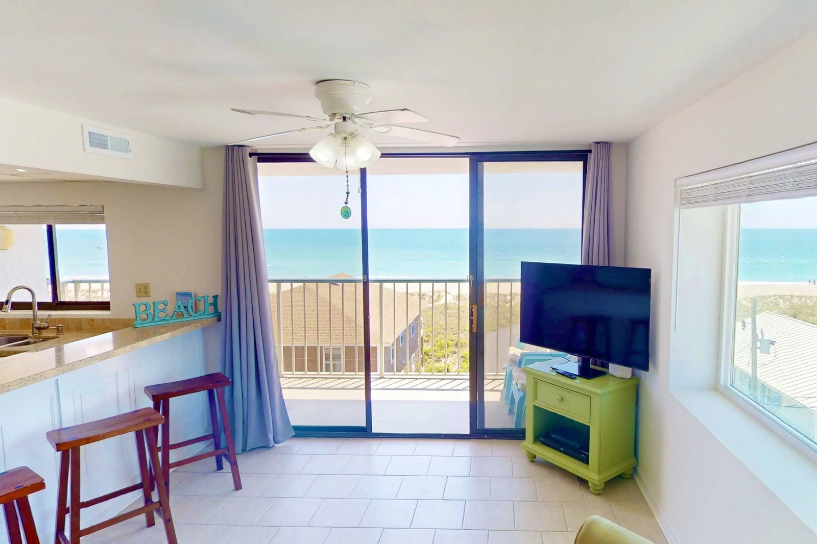 You'll enjoy a view of the ocean from the balcony, living room and kitchen