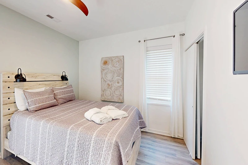 Bedroom 2 also offers a closet and wall mounted tv