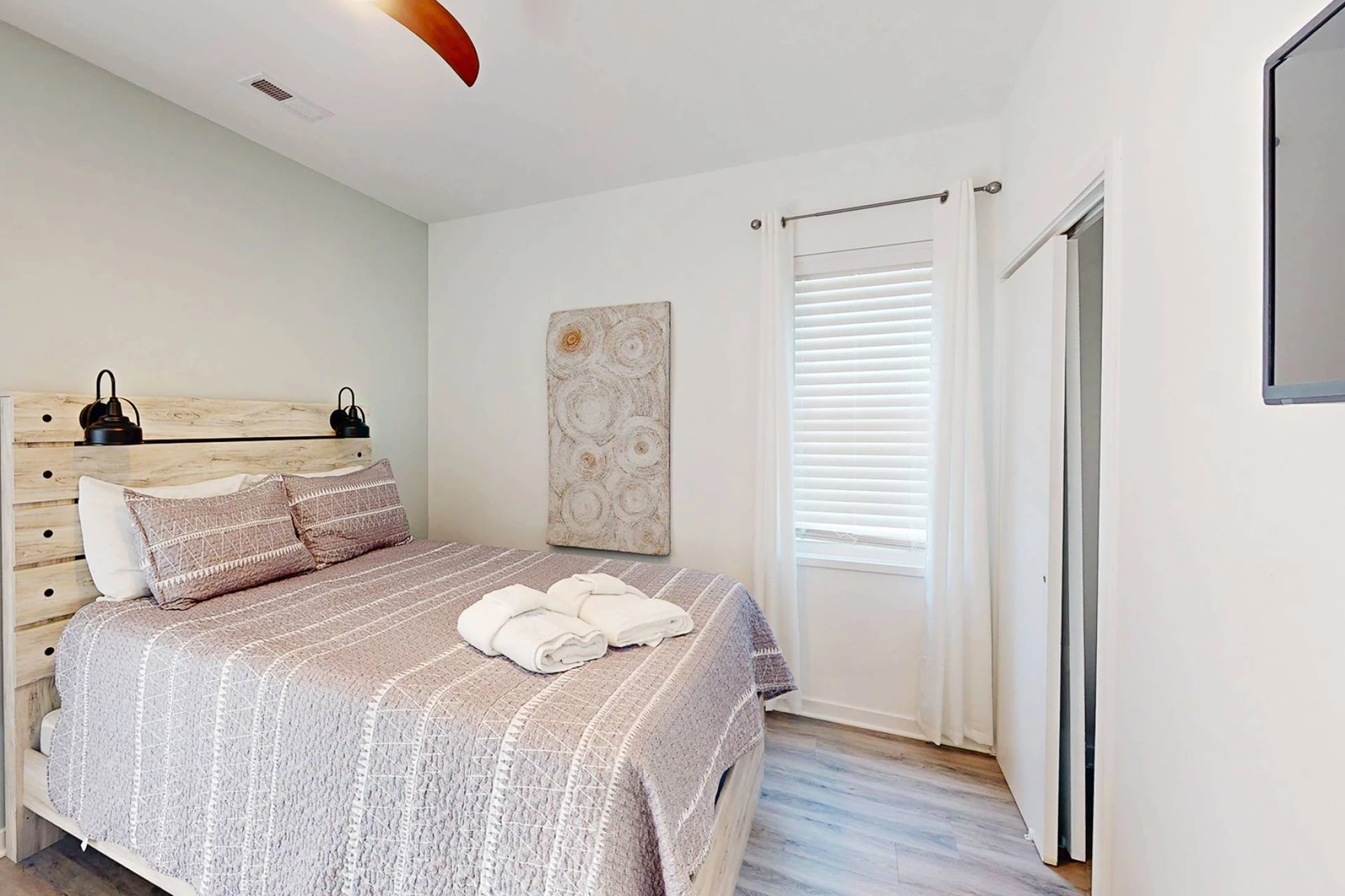 Bedroom 2 also offers a closet and wall mounted tv