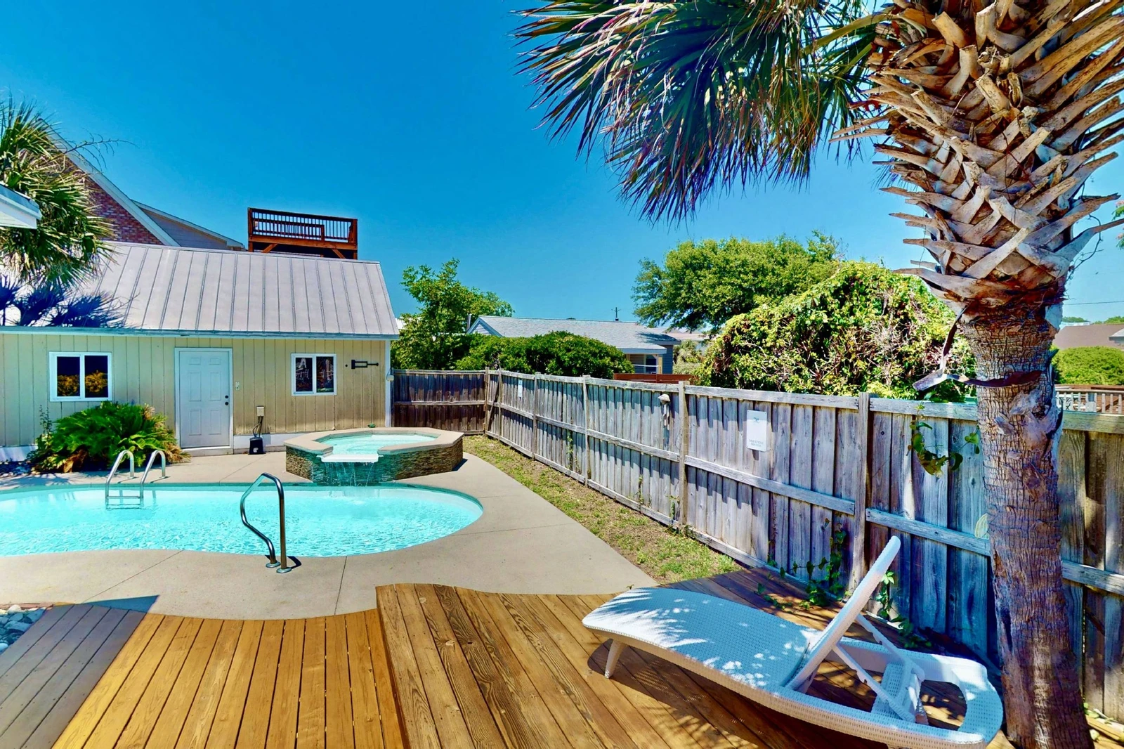 Get some sun or some shade in this beautiful backyard