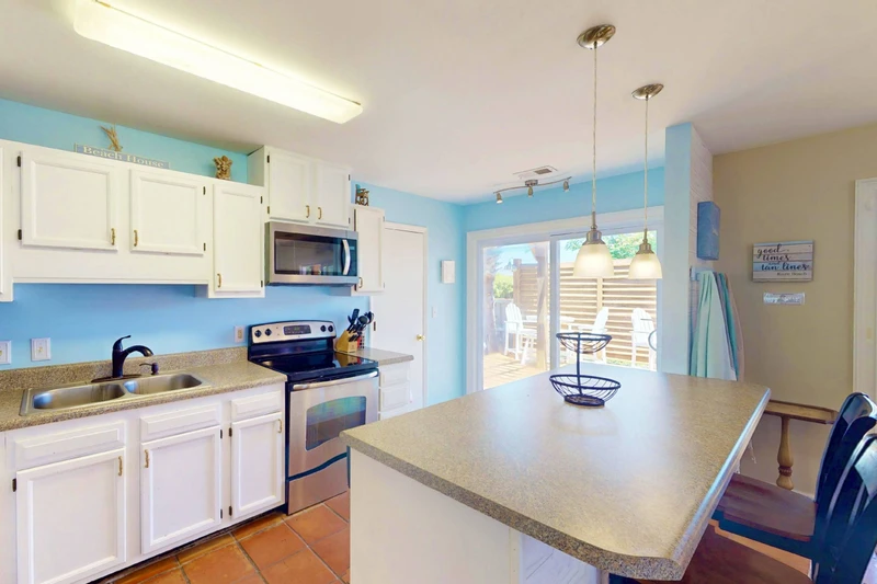 With two sets of sliding glass doors in the kitchen and dining room there is plenty of natural light