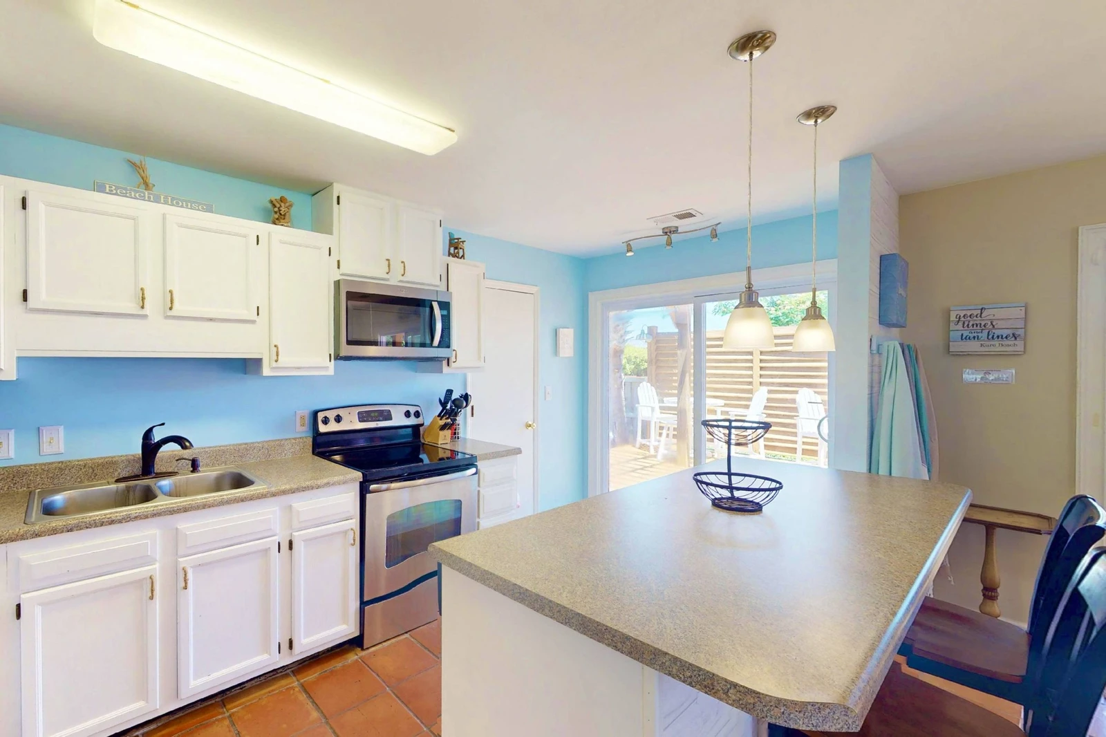 With two sets of sliding glass doors in the kitchen and dining room there is plenty of natural light