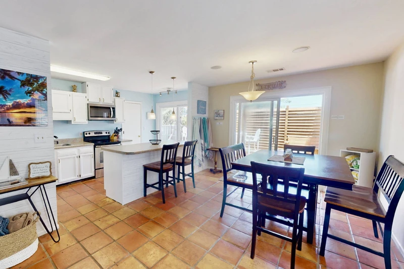You will have easy access to the pool and the deck through either of the large sliding doors