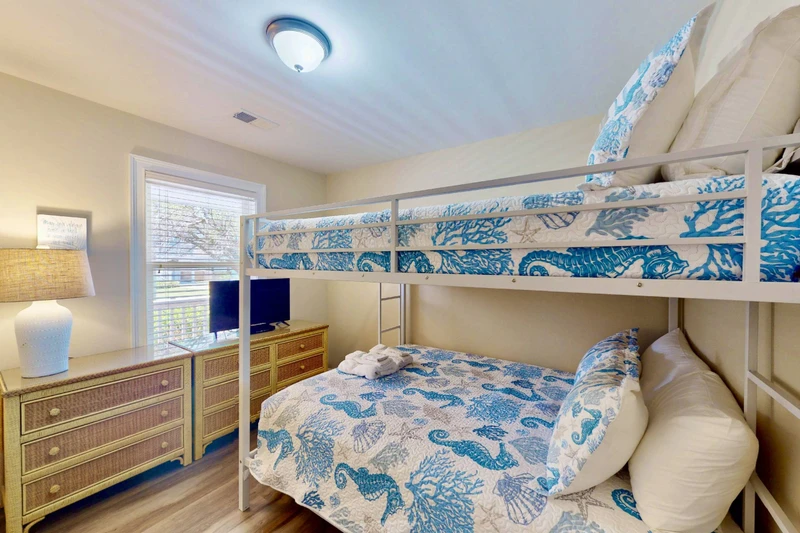 The 3rd bedroom offers a new queen over queen bunk bed