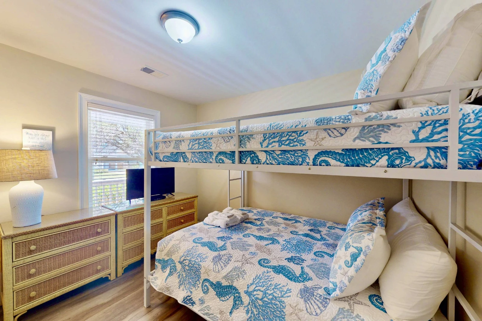 The 3rd bedroom offers a new queen over queen bunk bed