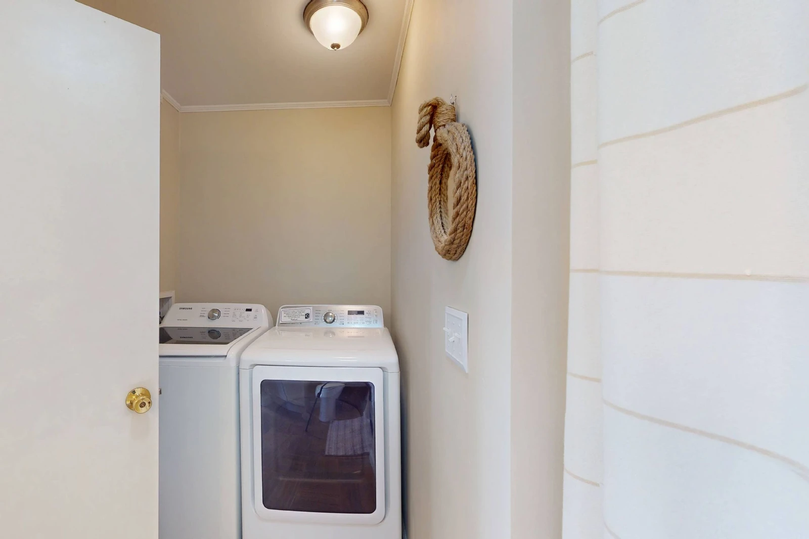 The updated laundry appliances are located in the en-suite bathroom