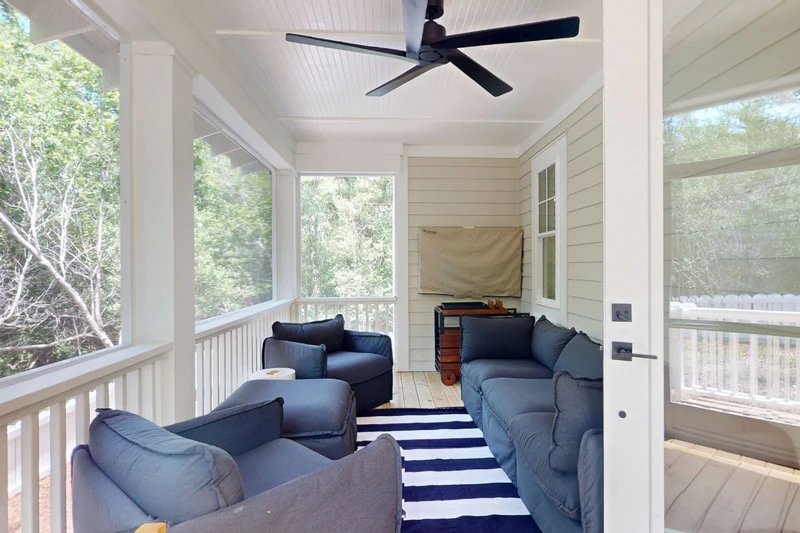 The porch has a wall mounted tv!