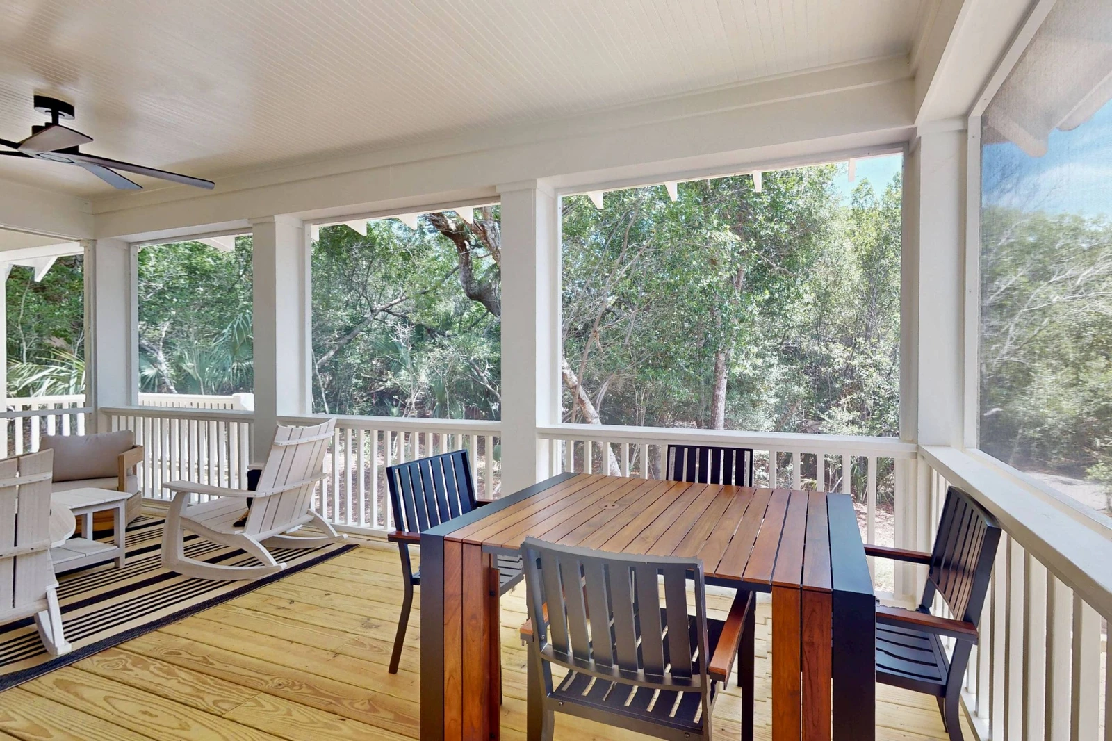 A screened in outdoor dining area is perfect for evenings outside