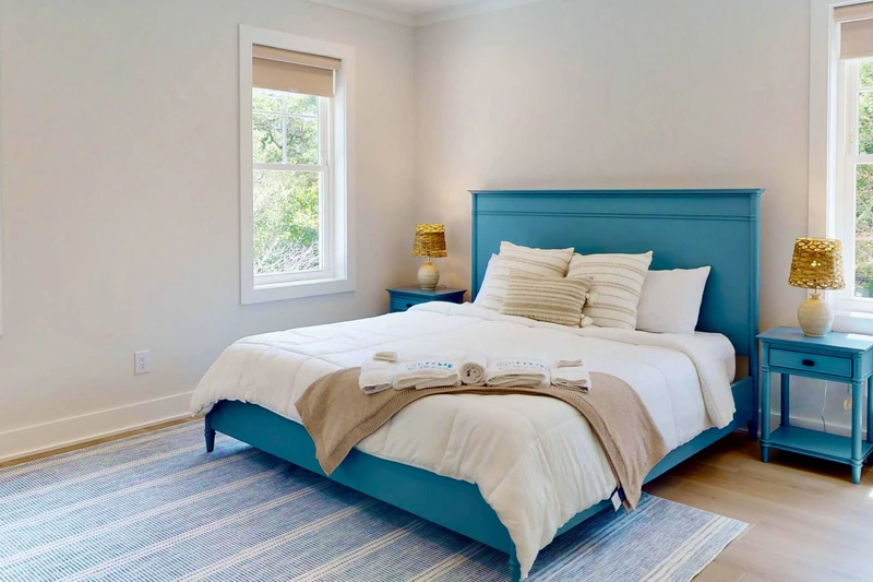 The upstairs suite offers a king bed, sitting area and plenty of natural light