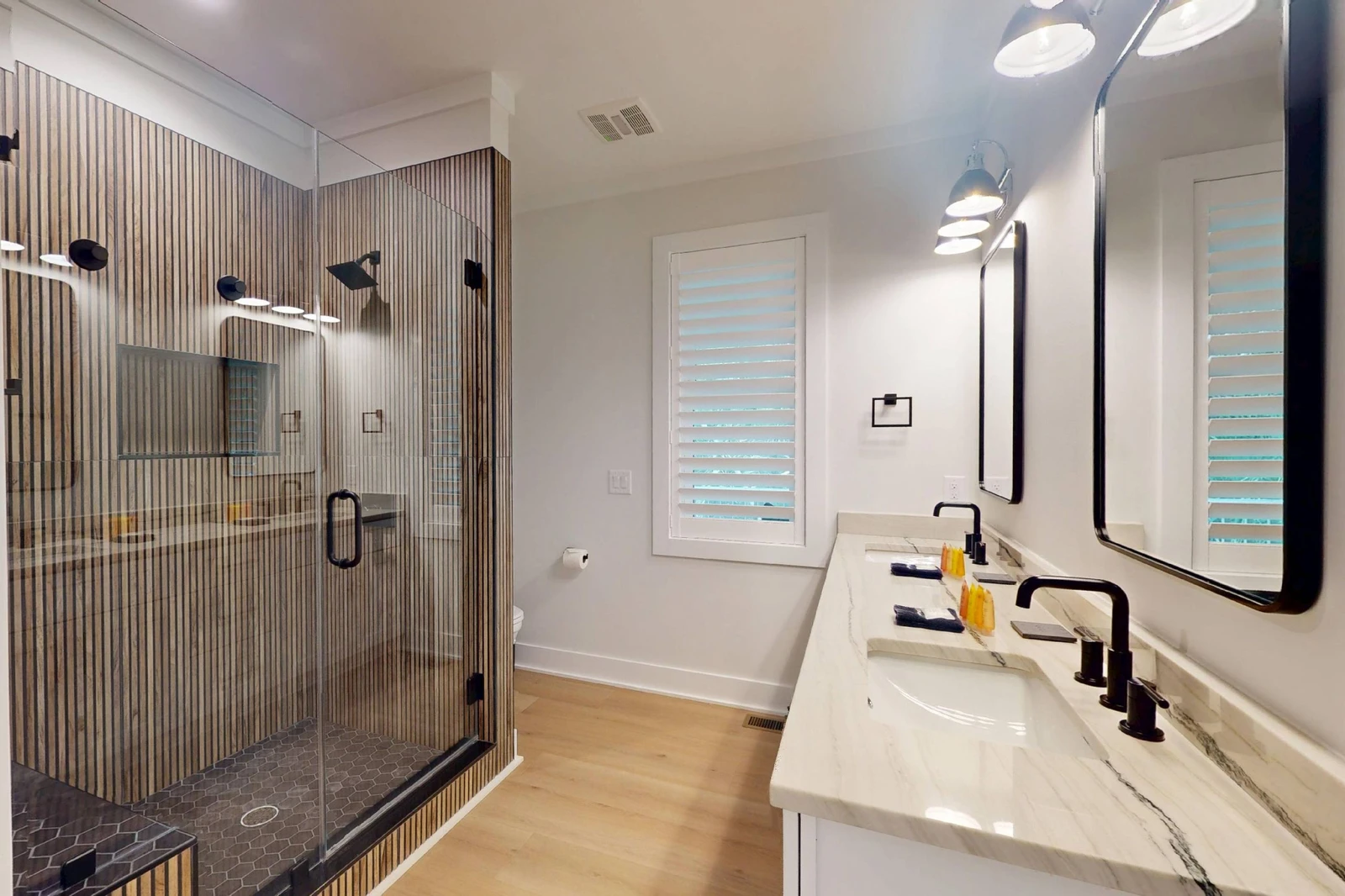 1st floor ensuite offers double sinks and a custom walk in shower with a rainfall shower head