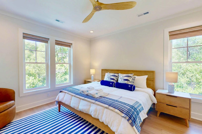 Bedroom 3 offers a king bed, sitting area and a lot of natural light