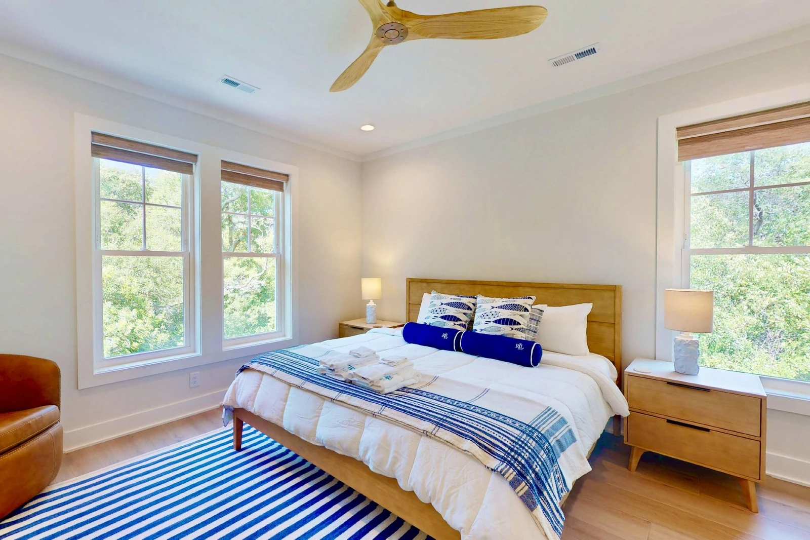 Bedroom 3 offers a king bed, sitting area and a lot of natural light