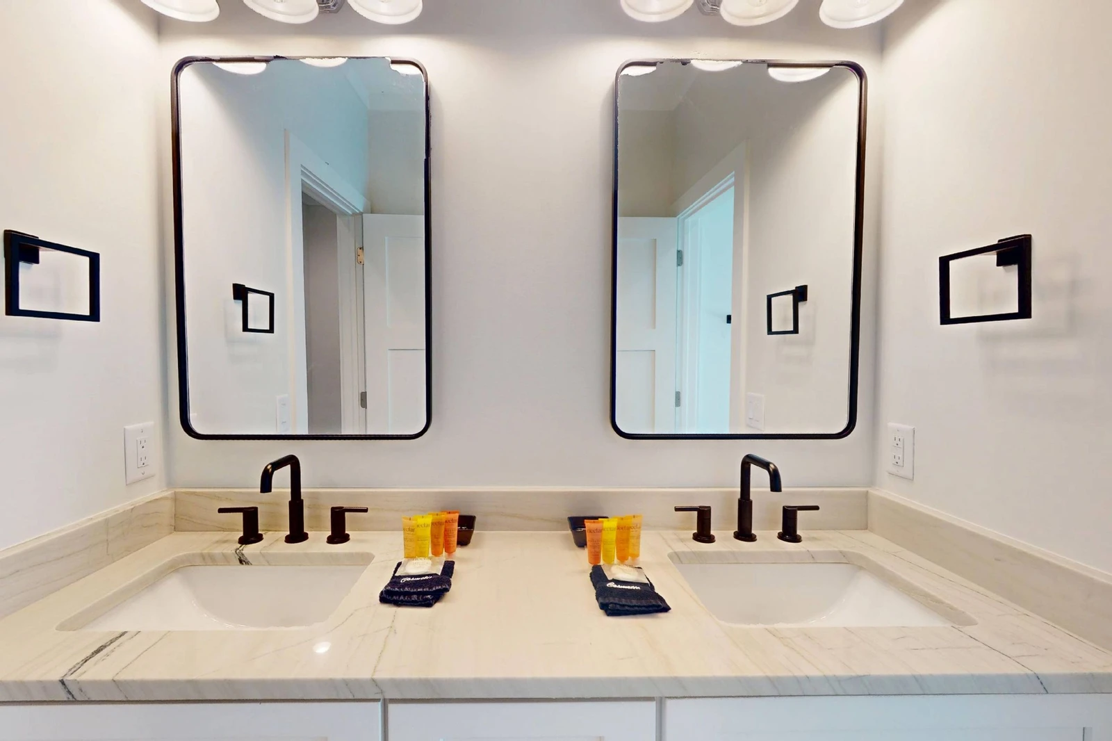 The upstairs hall bathroom offers double sink