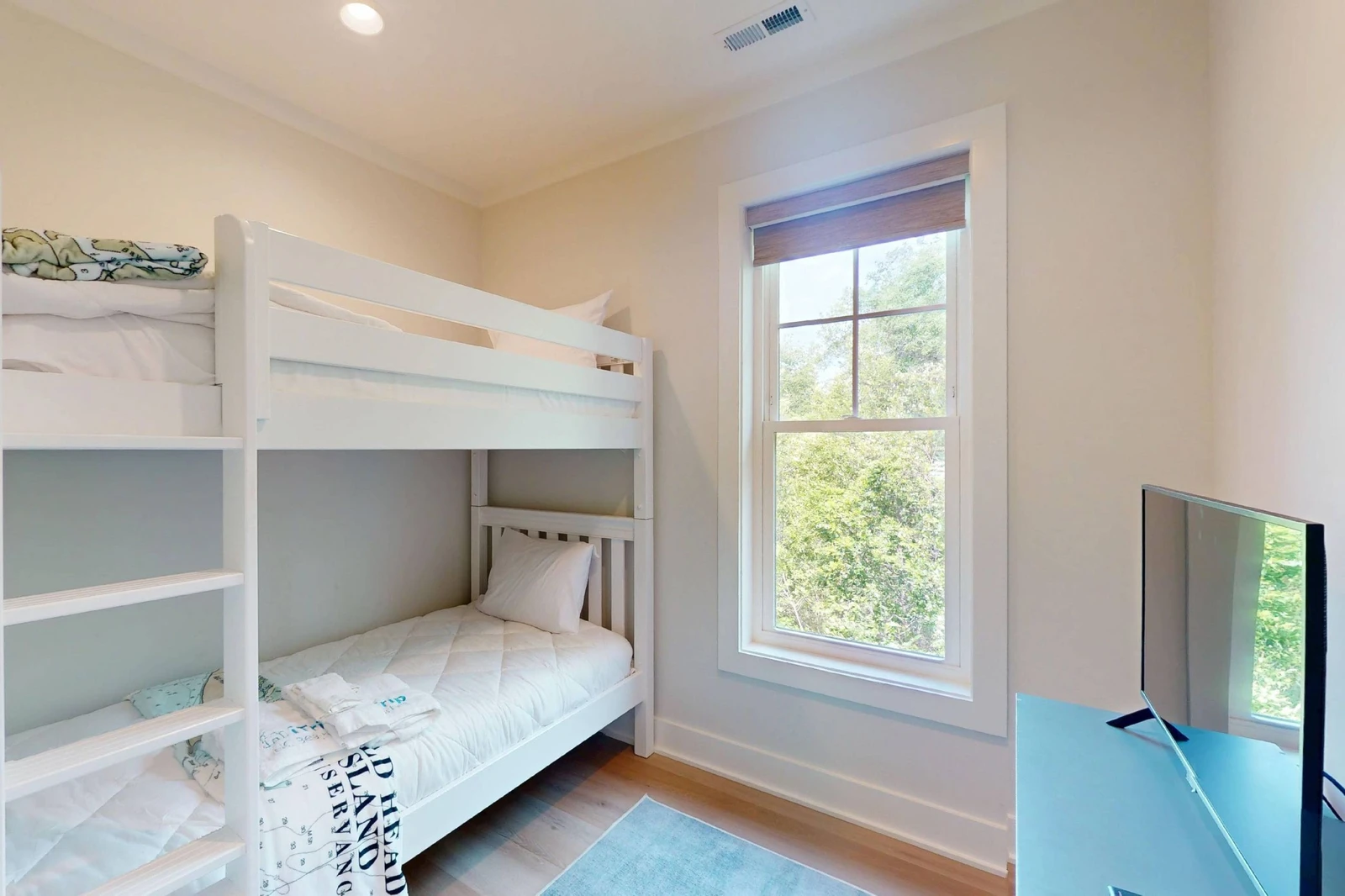 The bunk room offers XL twin over XL twin beds and a tv