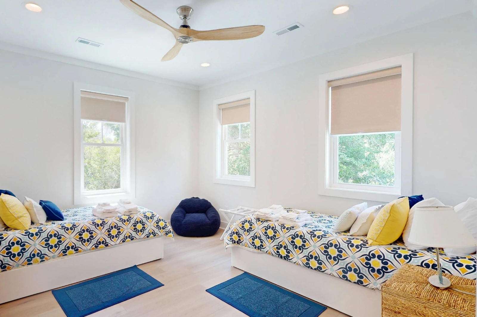 This bedroom offers two XL twin beds with XL twin trundles underneath - 4 beds total