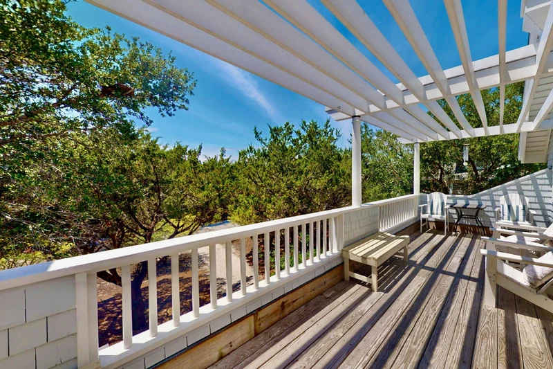 The top floor porch offers ample space to take in the lovely surroundings