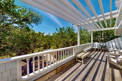 The top floor porch offers ample space to take in the lovely surroundings