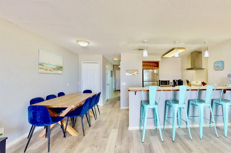 A large dining table and counter seating offer a spot for everyone