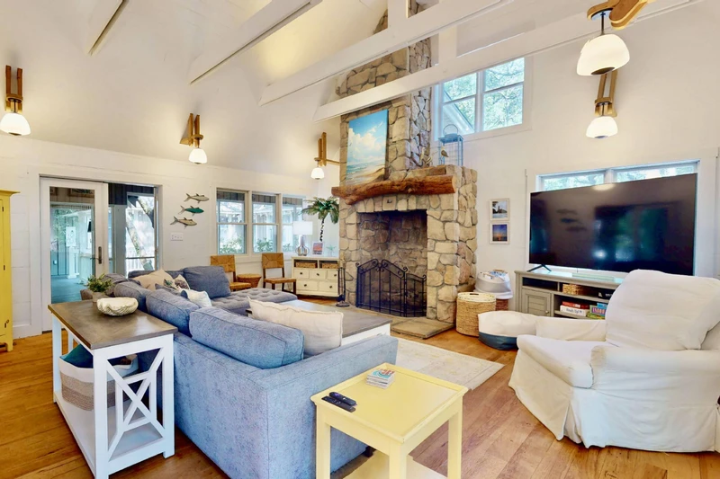 The beautiful stone fireplace is a focal point of the living room