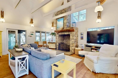 The beautiful stone fireplace is a focal point of the living room