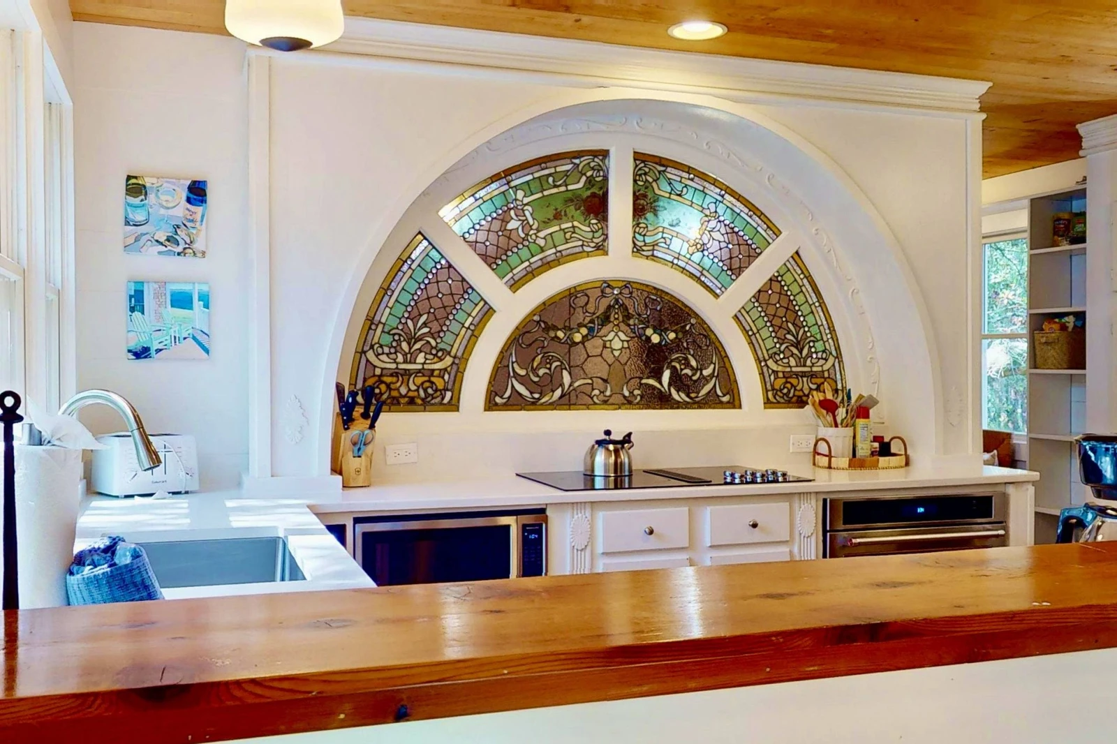 The stained glass window can be seen from the living room, as well!