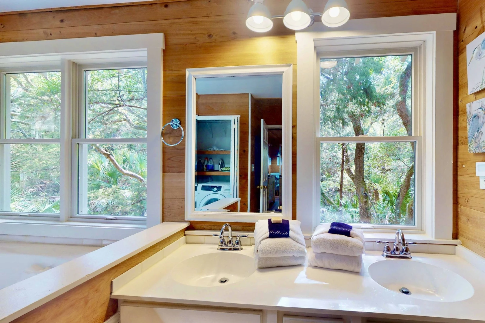 The owner's suite bathroom offers double sinks, a soaking tub and separate shower