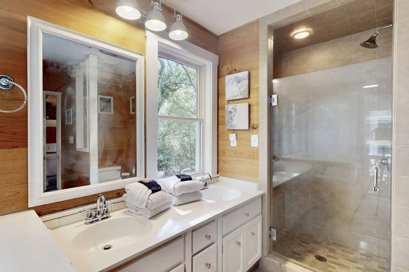 The owner's en-suite has a large walk-in shower