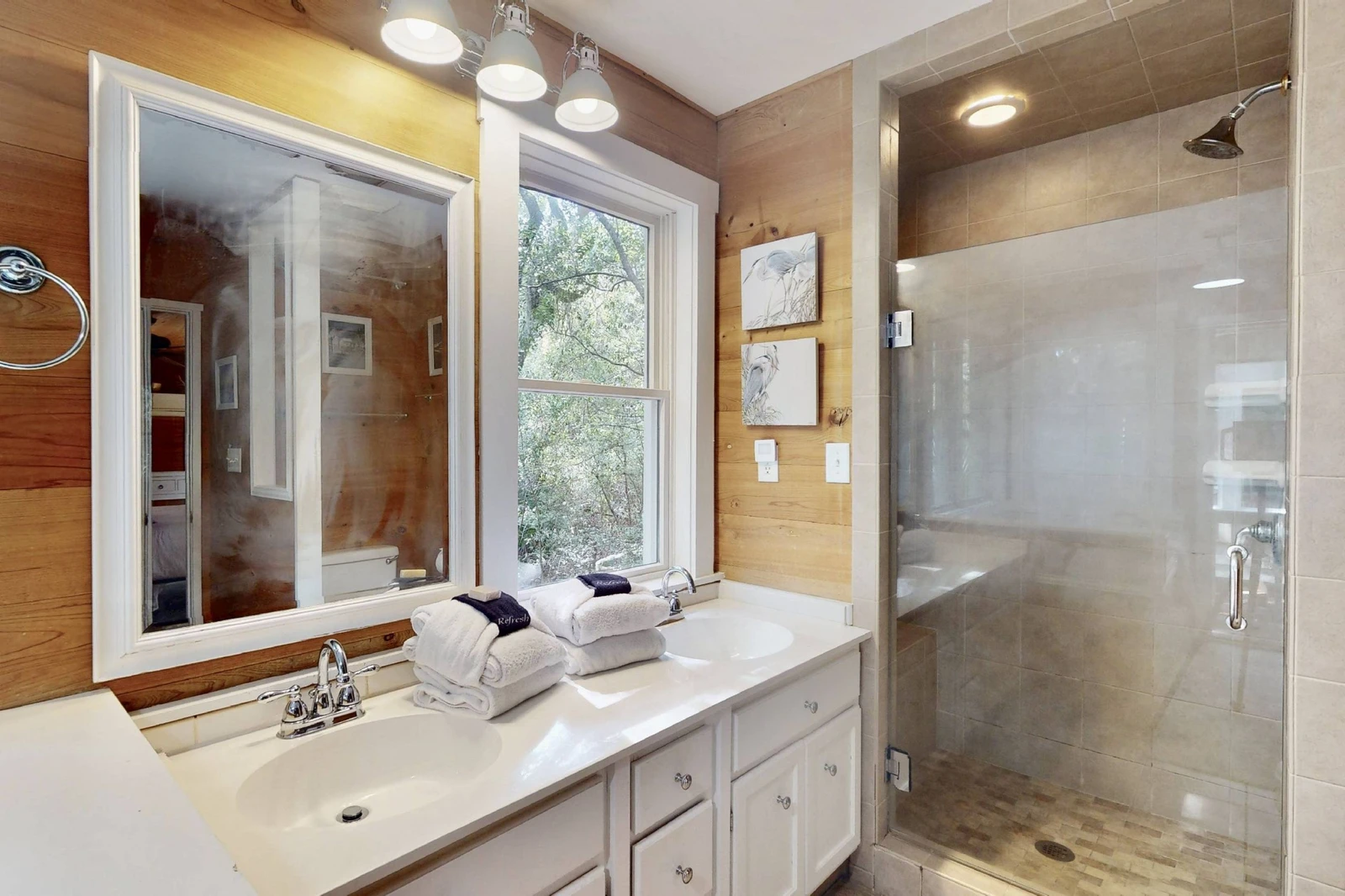 The owner's en-suite has a large walk-in shower