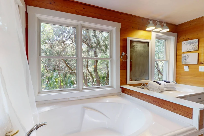 A large soaking tub can be found in the owner's en-suite