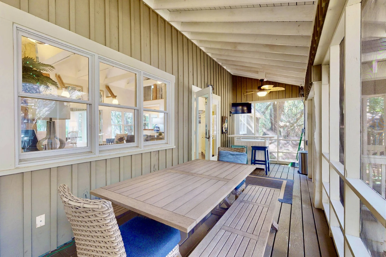 The large table on the screened in sun room is great for meals, games or chatting