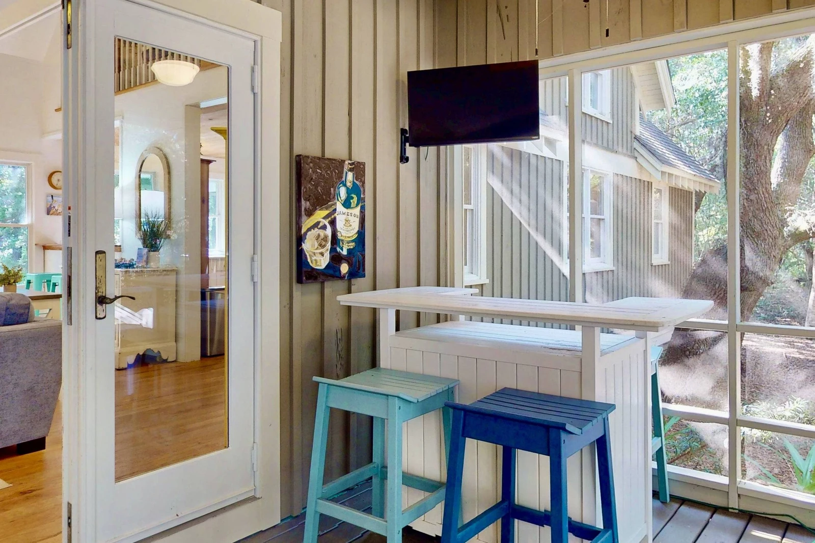 Mix some drinks at the bar on the screened in sun room