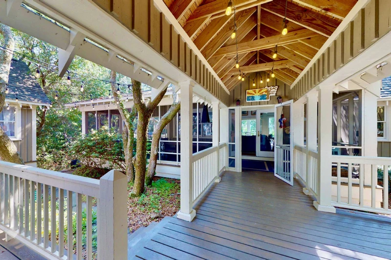 A covered walkway connects the main house to the guest wing