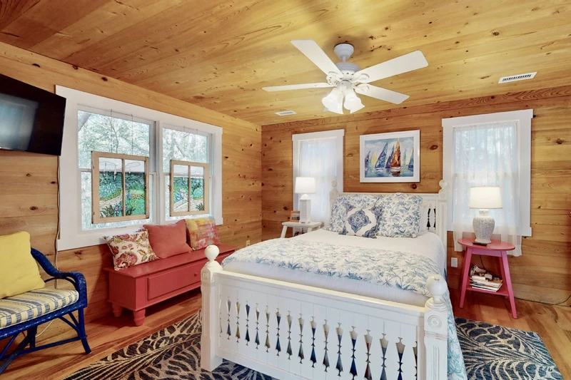 The second queen bedroom in the guest wing has a wall mounted tv and direct access to the double & twin bedroom - perfect for families with children