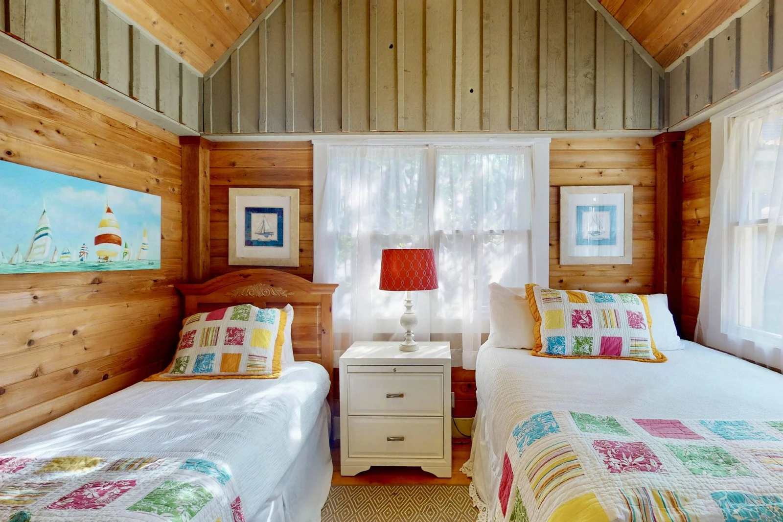The third bedroom in the guest wing (accessed through the second queen room) has a double bed and a twin bed