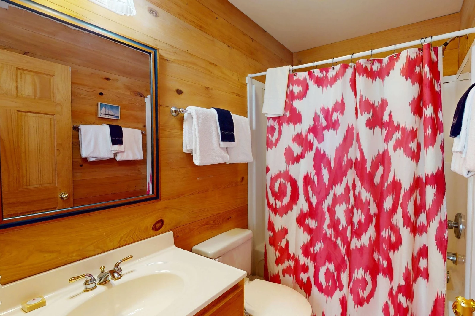Second full hall bathroom with a tub/shower combo in the guest wing