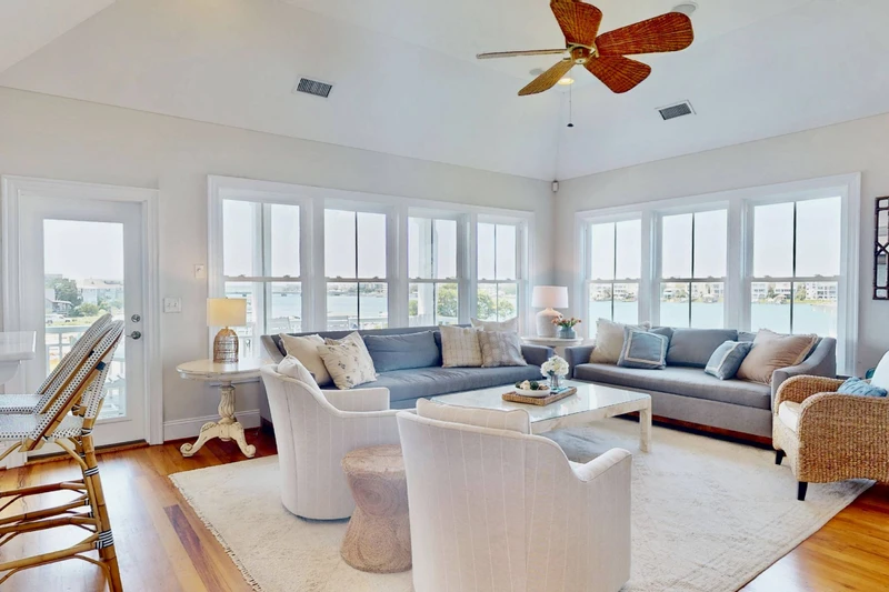 This home features a spacious living room with stunning views and plenty of seating