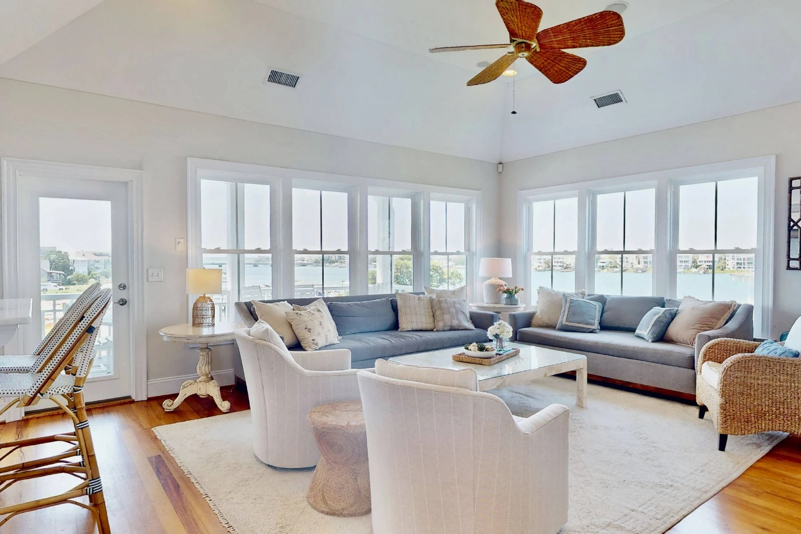 This home features a spacious living room with stunning views and plenty of seating