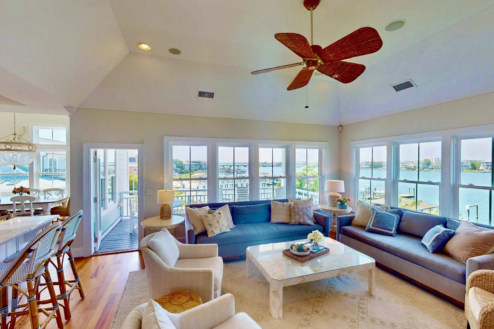 Windows surround the living area on two sides with sound views